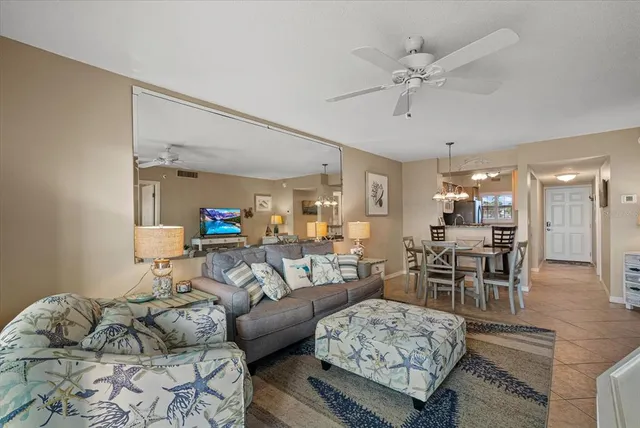 a view of a dining room with furniture wooden floor and chandelier