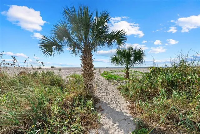 a view of a swimming pool with outdoor seating
