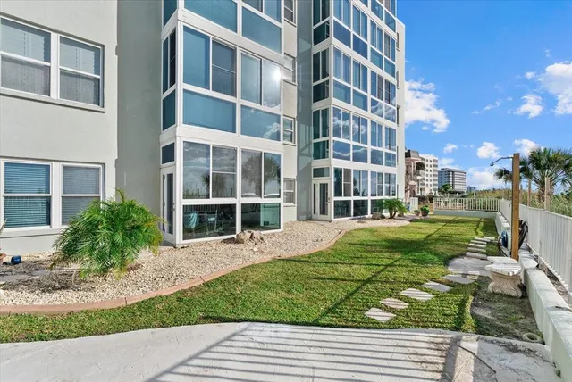 a view of a patio with a table chairs and a table
