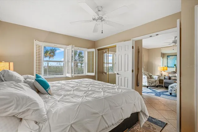 a view of a room with wooden floor and a large window