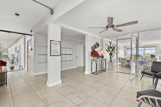 a kitchen with stainless steel appliances kitchen island granite countertop a stove and white cabinets