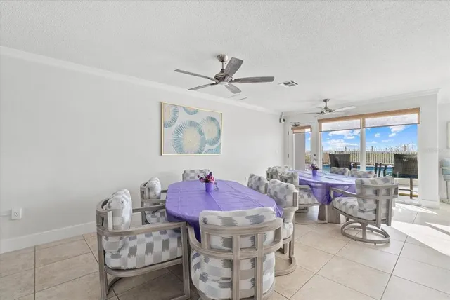a living room with furniture a rug and a chandelier