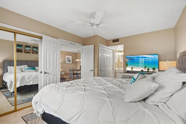 a room with mirror and furniture