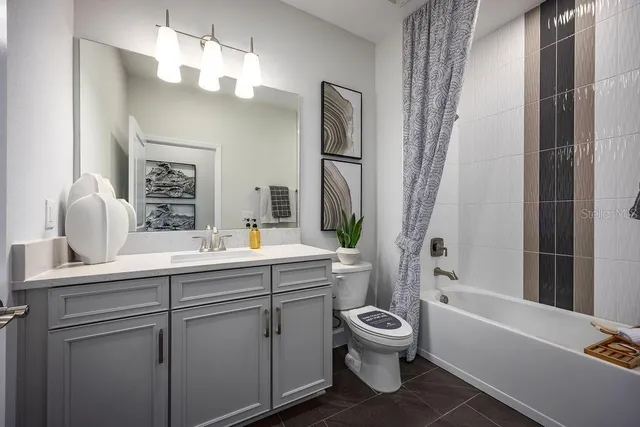 a bathroom with a toilet a sink and a bathtub