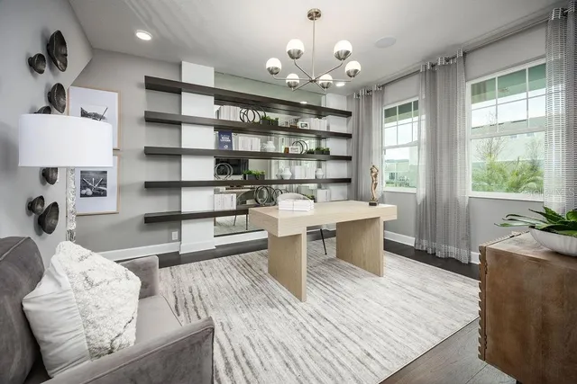 a living room with furniture flat screen tv and window