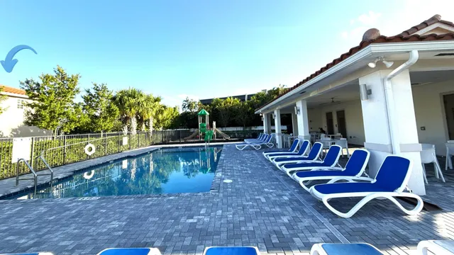 a view of a chairs and tables in the balcony
