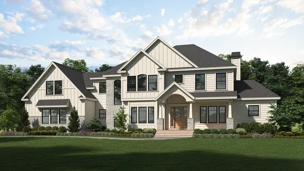 a front view of a house with a garden