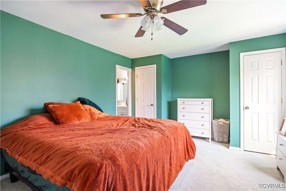 11629 East Briar Patch Drive Midlothian, VA 23113 - Photo 13 of 18 a bedroom with a bed and a chandelier