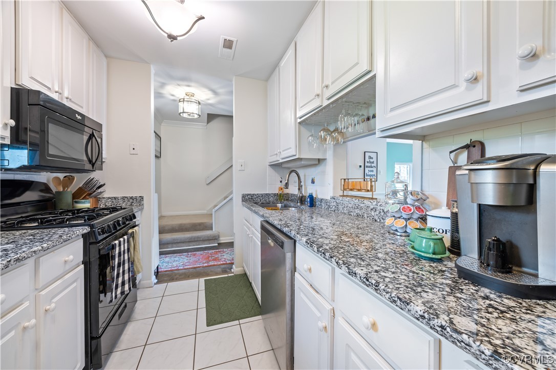 11629 East Briar Patch Drive Midlothian, VA 23113 - Photo 5 of 18 a kitchen with stainless steel appliances granite countertop a sink stove and refrigerator