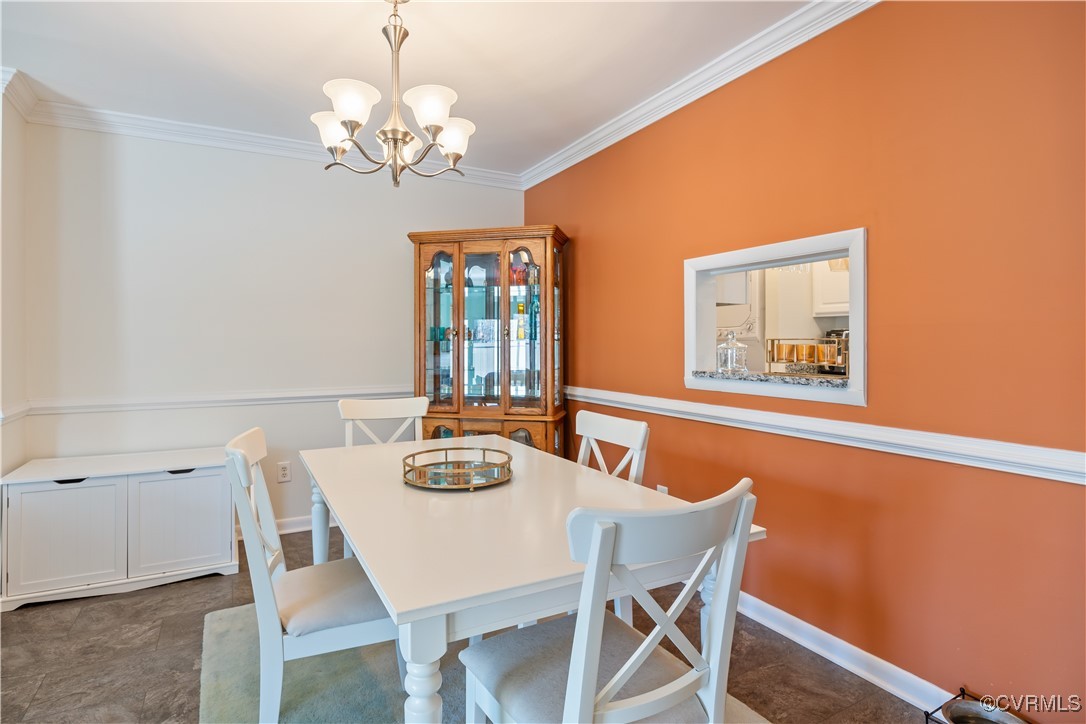 11629 East Briar Patch Drive Midlothian, VA 23113 - Photo 8 of 18 a view of a dining room with furniture and chandelier