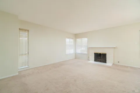 an empty room with fireplace