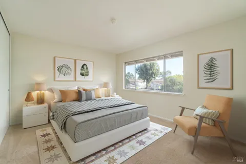 a bedroom with a bed and a couch