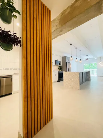 a view of a kitchen with a refrigerator a sink and a dishwasher