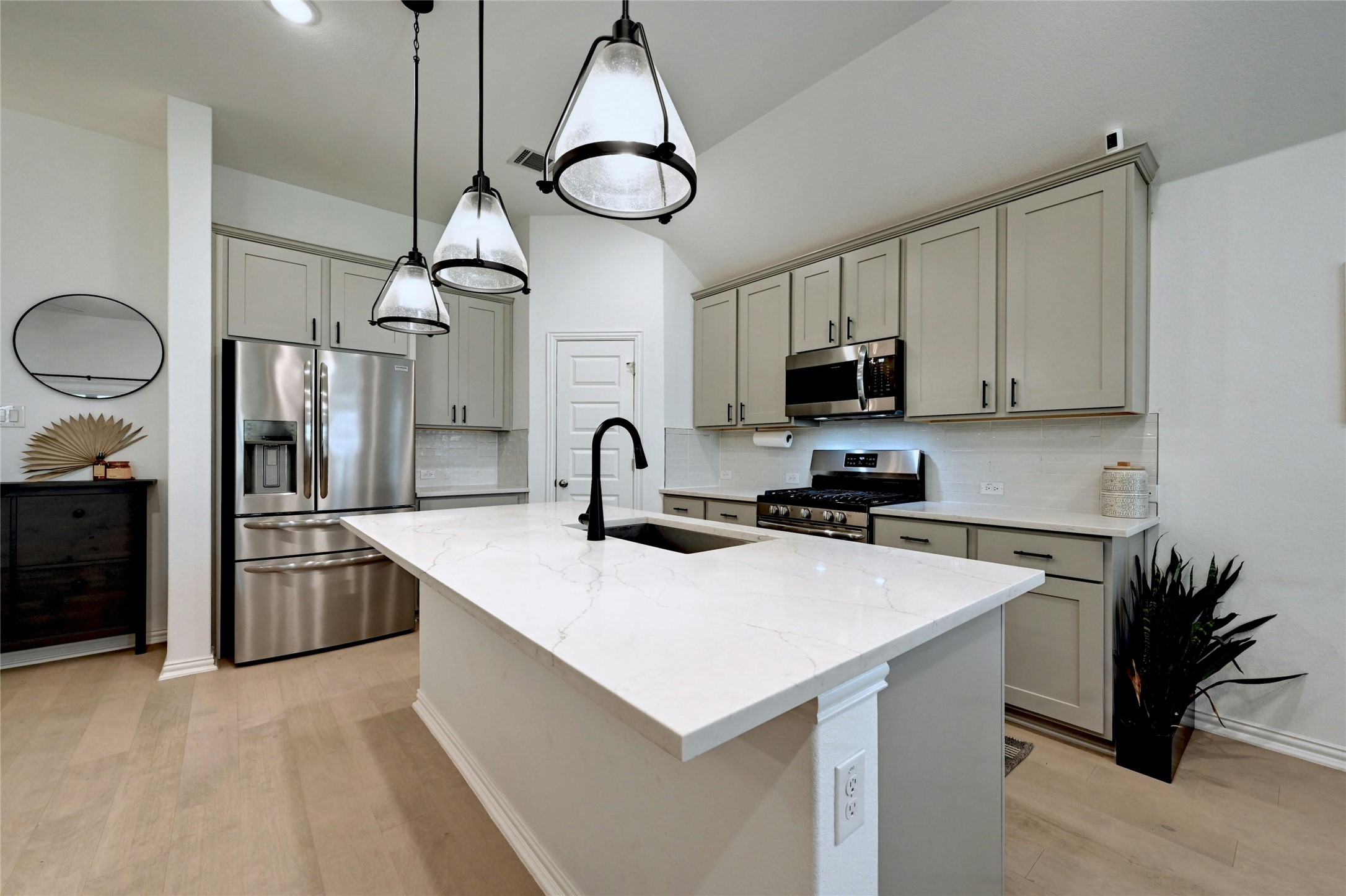 757 Cherrystone Loop Buda, TX 78610 - Photo 13 of 33 Elegant kitchen island with a marble countertop