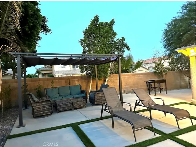 a view of a room with wooden floor and window