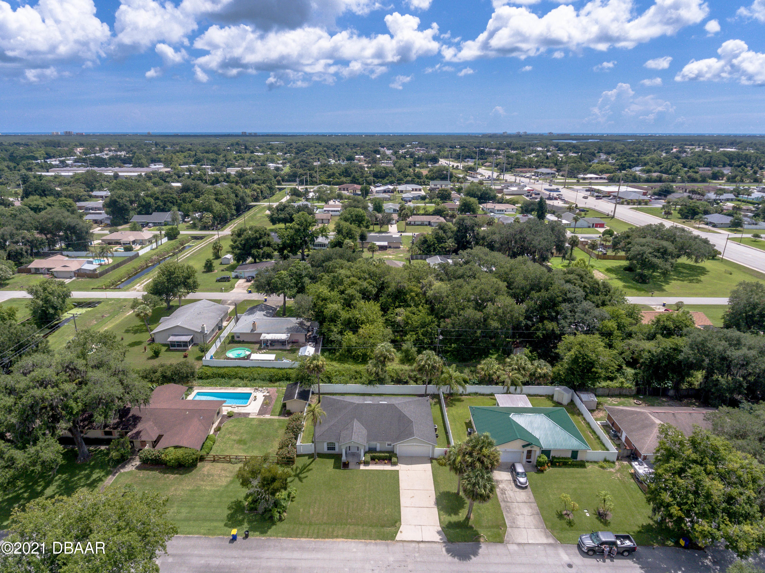1811 Lime Tree Drive Edgewater, FL 32132 - Photo 2 of 35 an aerial view of residential houses with outdoor space and trees