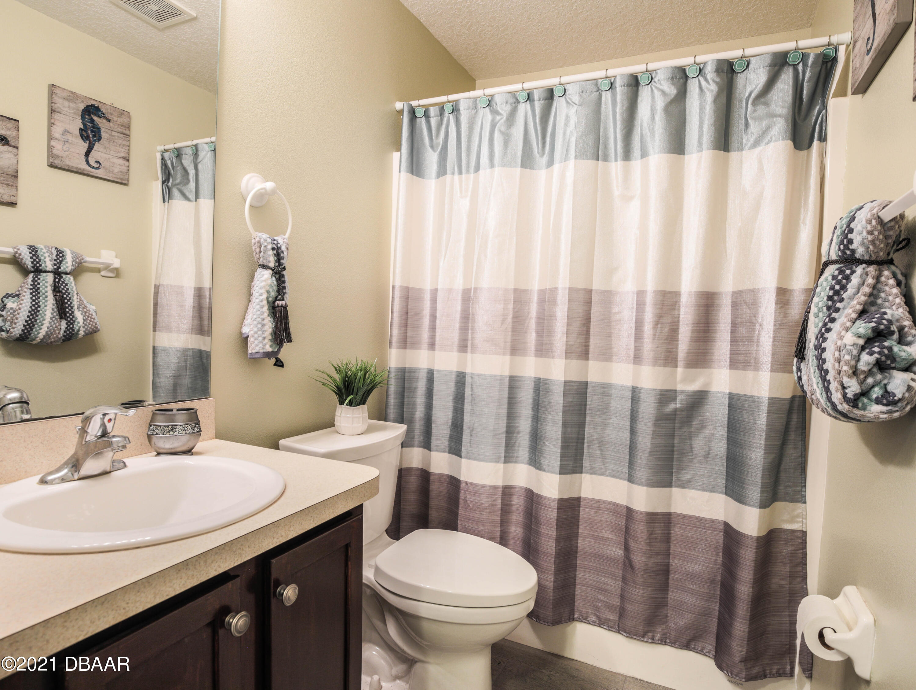 1811 Lime Tree Drive Edgewater, FL 32132 - Photo 22 of 35 a bathroom with a sink and toilet