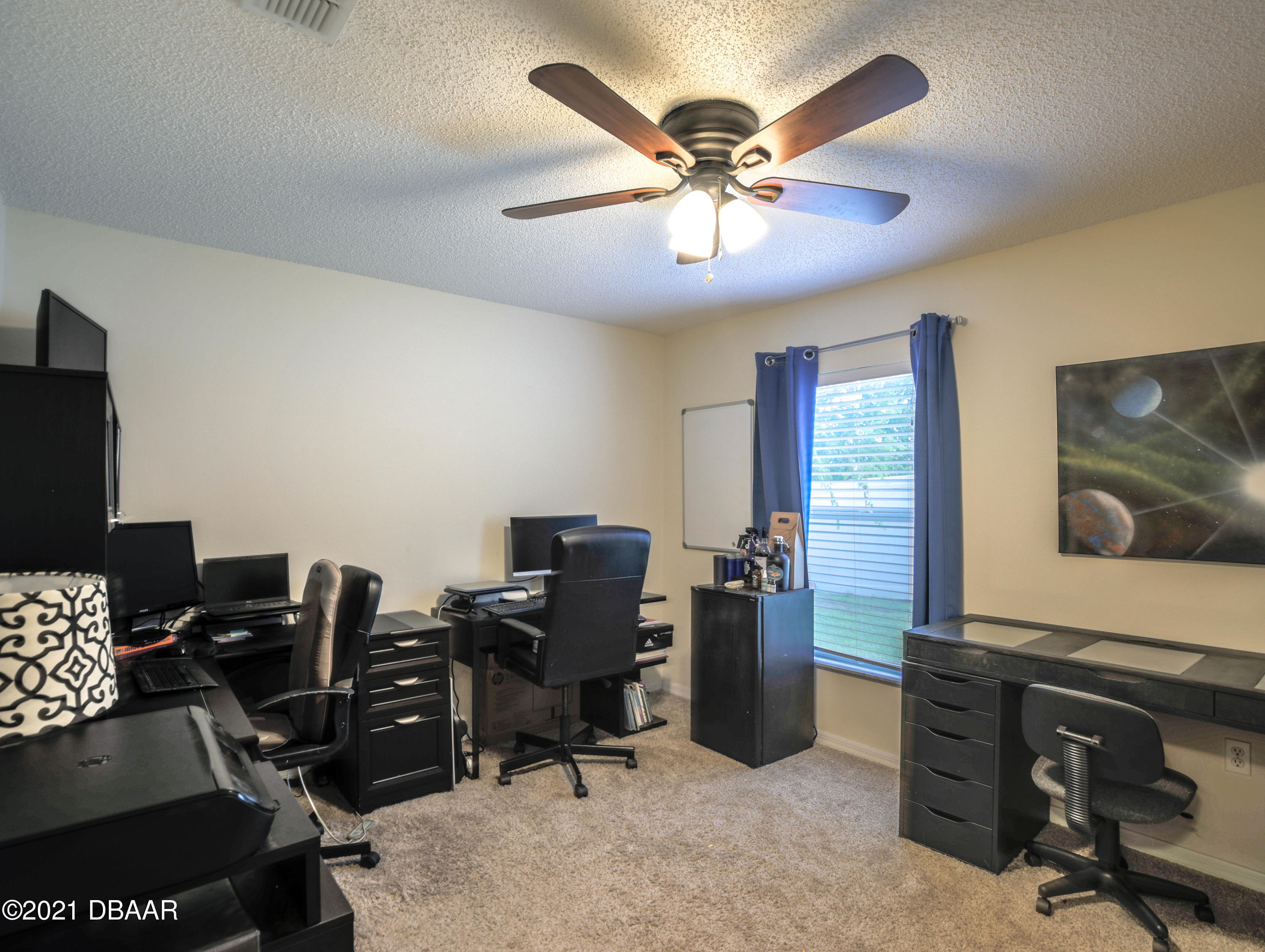 1811 Lime Tree Drive Edgewater, FL 32132 - Photo 23 of 35 a view of a workspace with furniture and a window