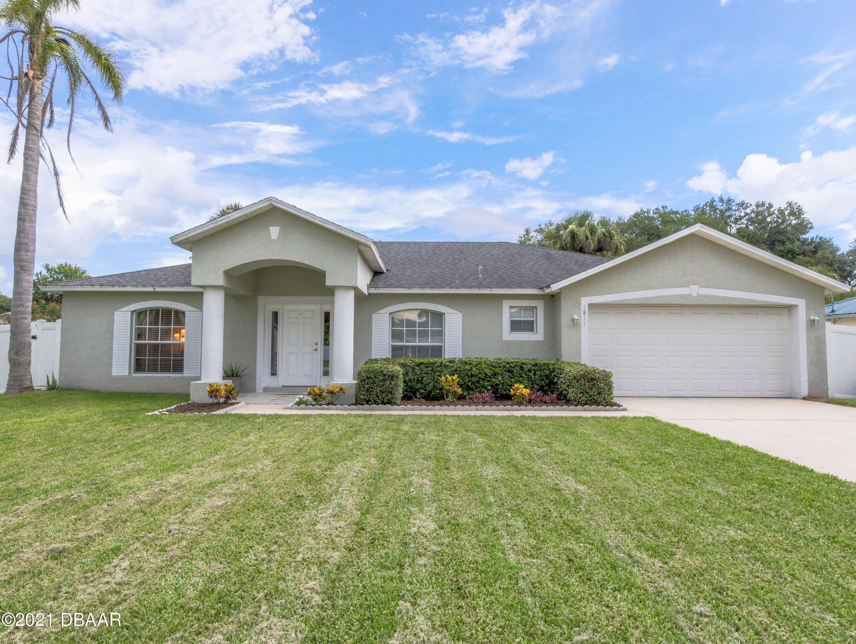 1811 Lime Tree Drive Edgewater, FL 32132 - Photo 27 of 35 a front view of a house with a yard