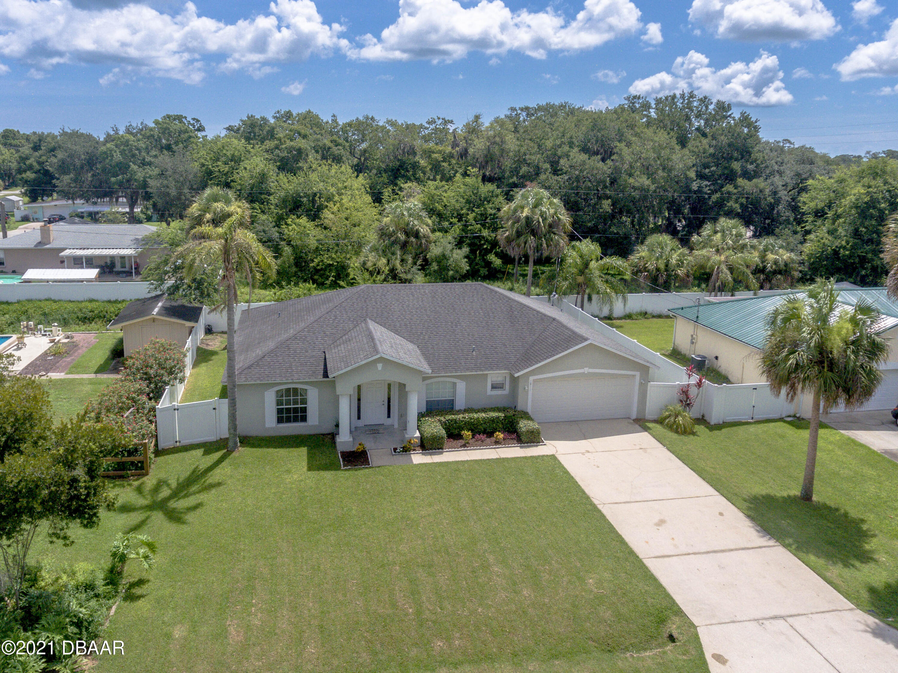 1811 Lime Tree Drive Edgewater, FL 32132 - Photo 33 of 35 an aerial view of a house with swimming pool and a yard
