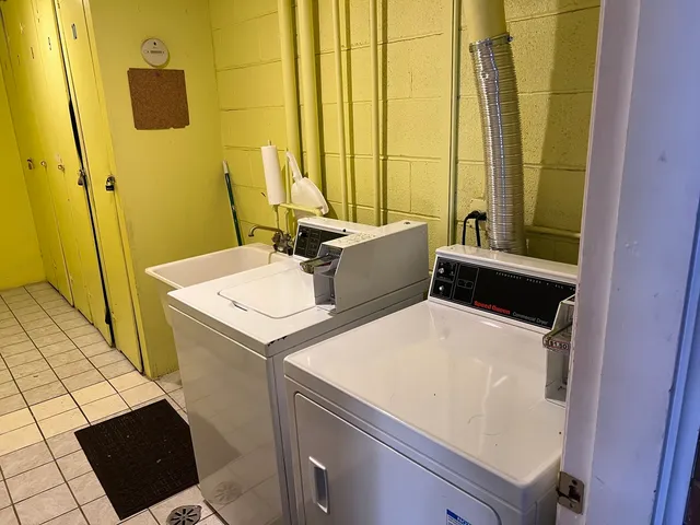 a bathroom with a sink and a washing machine