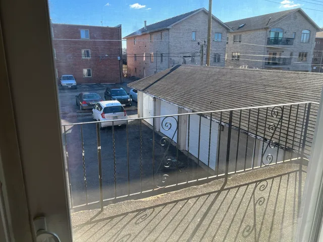 a view of balcony with wooden floor