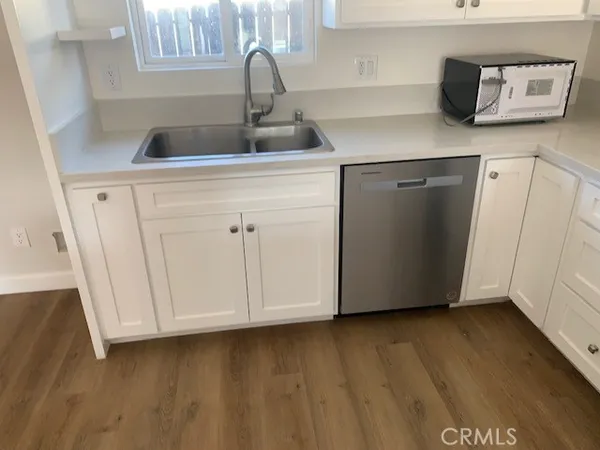 a kitchen with a sink and cabinets