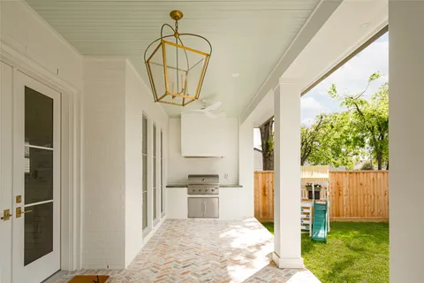 a view of a house with a backyard porch and sitting area