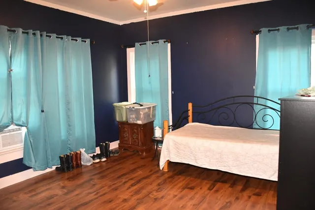 a bedroom with a bed and window