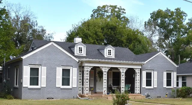 a front view of a house with garden