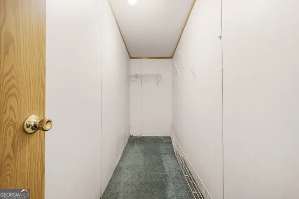 a bathroom with a toilet sink and a mirror