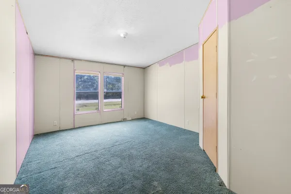 an empty room with windows