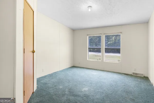a bathroom with a granite countertop toilet a sink and a bathtub