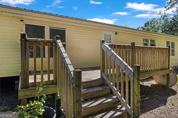 a wooden deck with trees