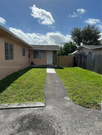 a view of a backyard of the house