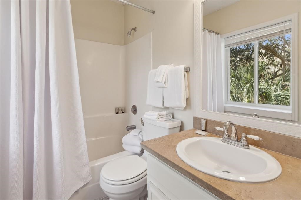 2004 Beachwood Road, Unit 2004 Fernandina Beach, FL 32034 - Photo 40 of 54 a bathroom with a sink toilet and shower