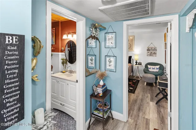 a bathroom with a toilet a sink and a window