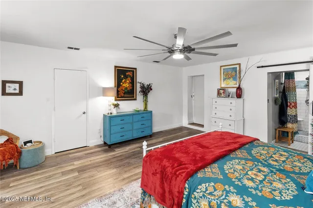 a bed room with a bed and a window