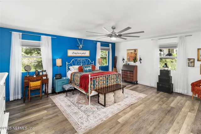a bathroom with a sink vanity mirror and shower