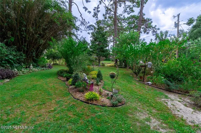 a view of a chairs and table in patio with potted plants