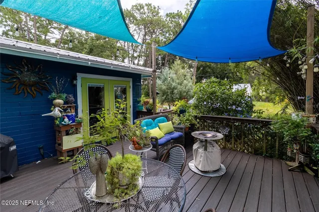 a outdoor dining space with furniture and outdoor view