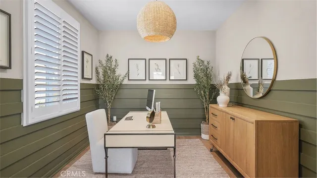 a view of a dining room with furniture and window