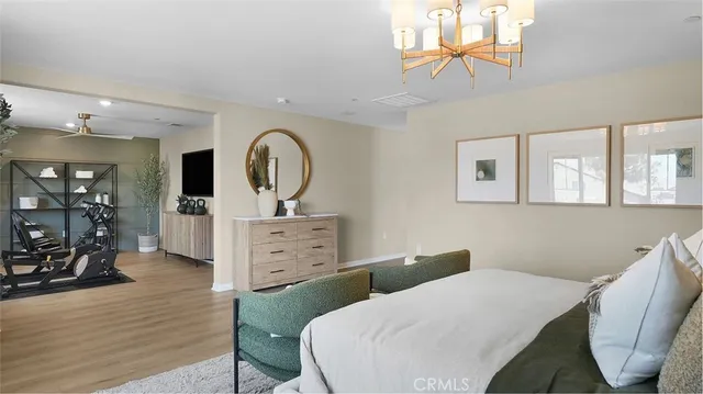 a bed room with a bed and a television