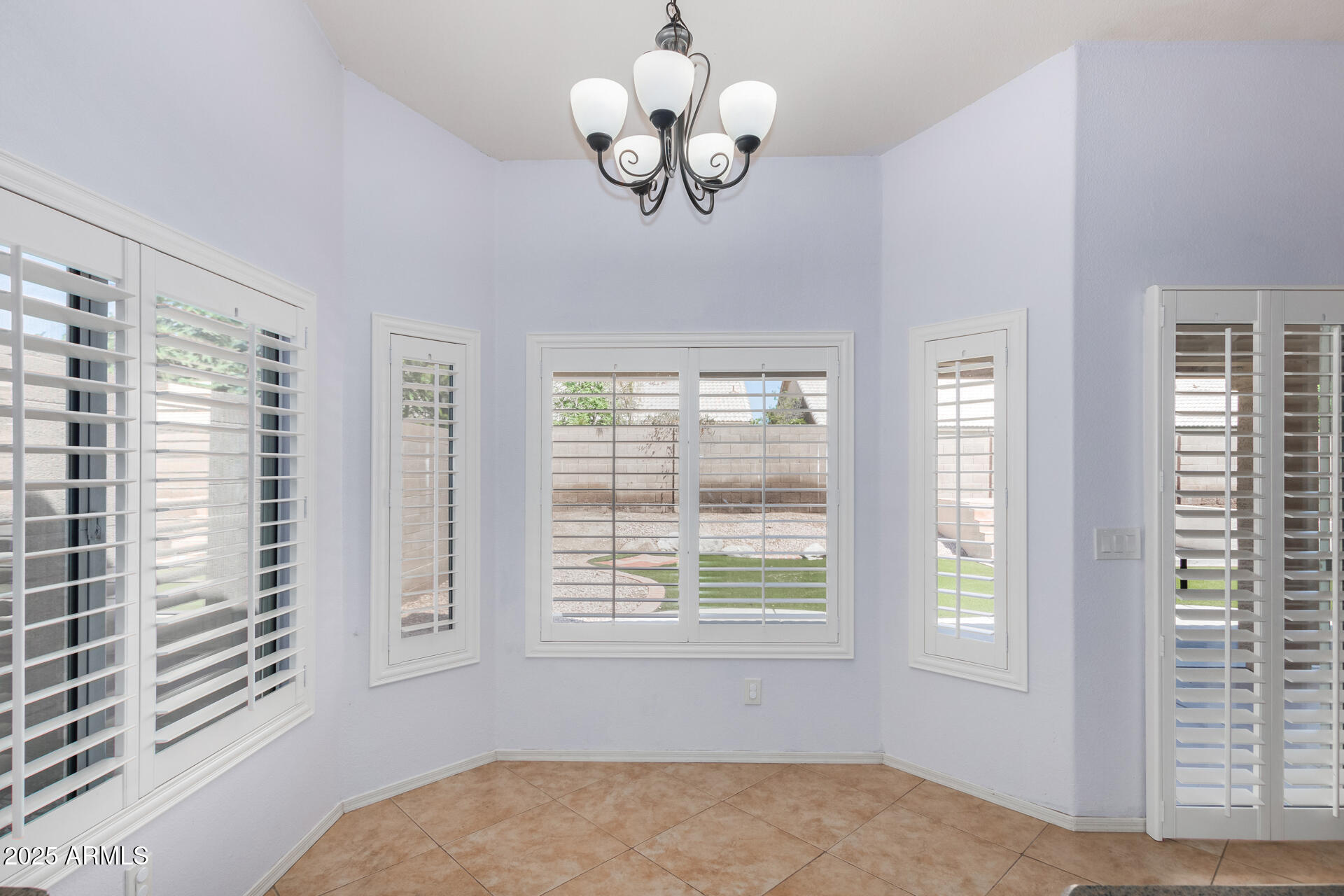 4226 East Rockledge Road Phoenix, AZ 85044 - Photo 11 of 36 a view of an empty room with a window