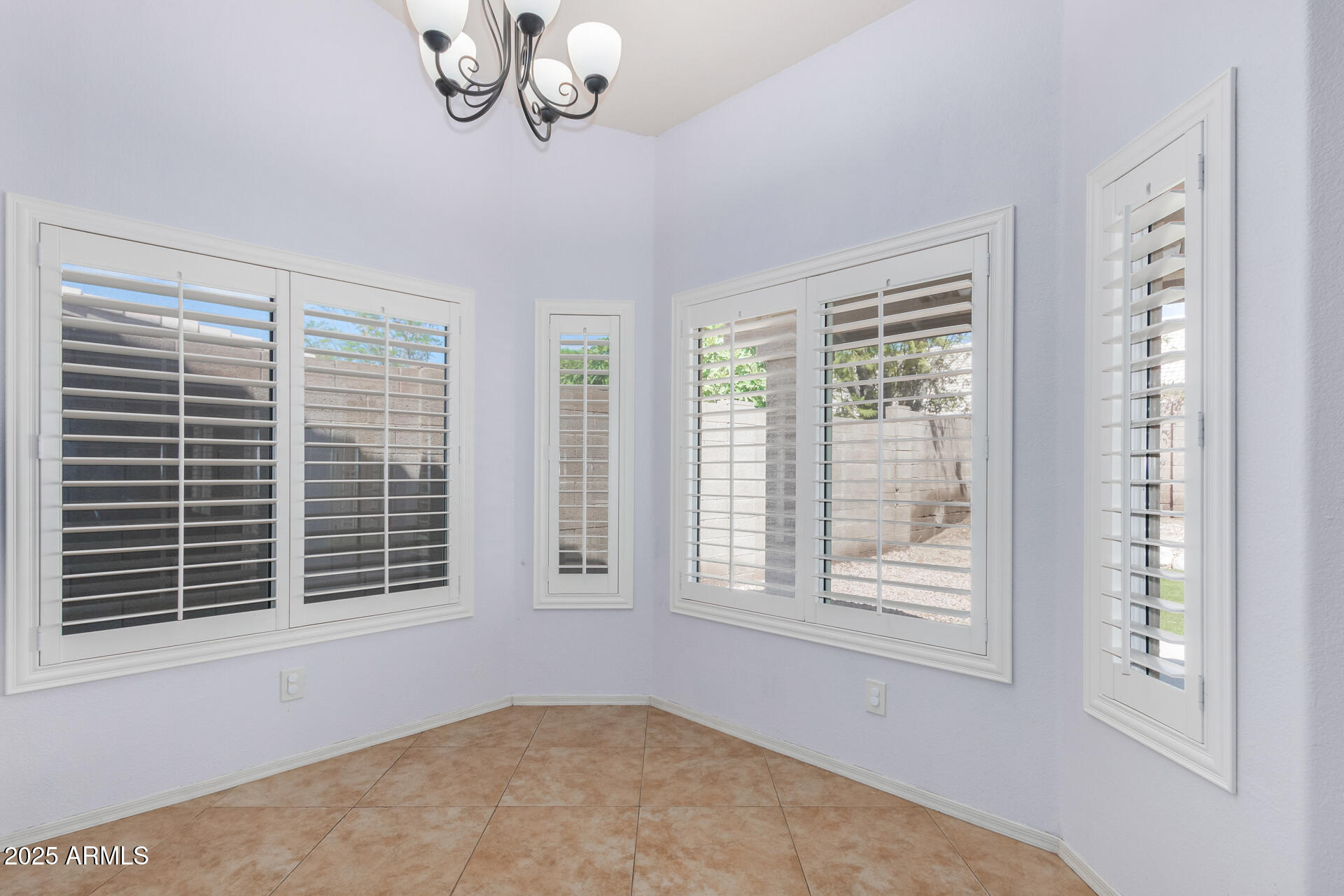 4226 East Rockledge Road Phoenix, AZ 85044 - Photo 12 of 36 a view of an empty room with a window