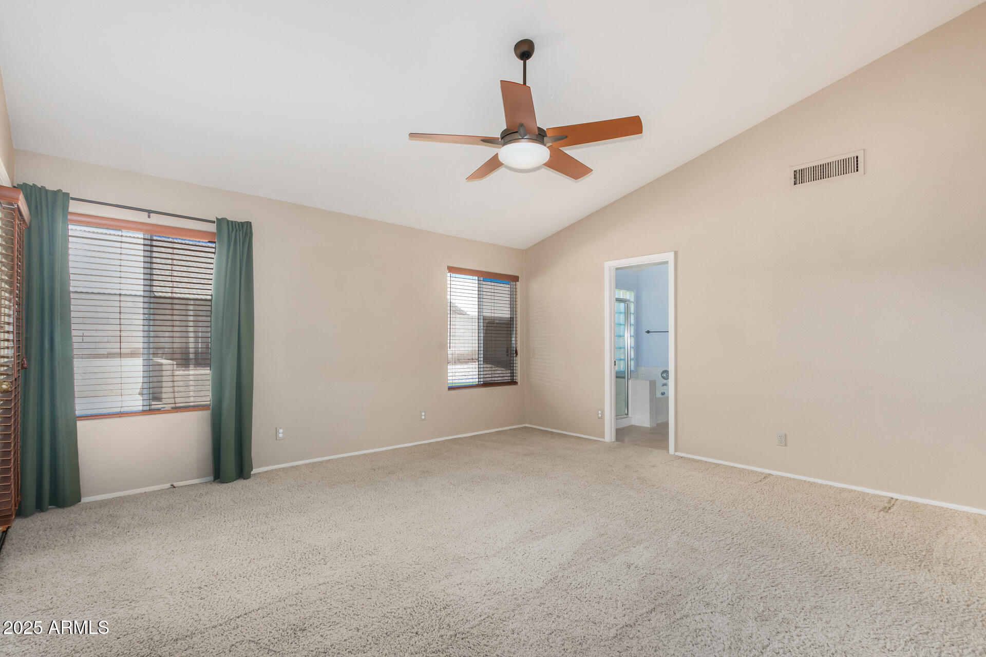 4226 East Rockledge Road Phoenix, AZ 85044 - Photo 16 of 36 a view of empty room with window and ceiling fan