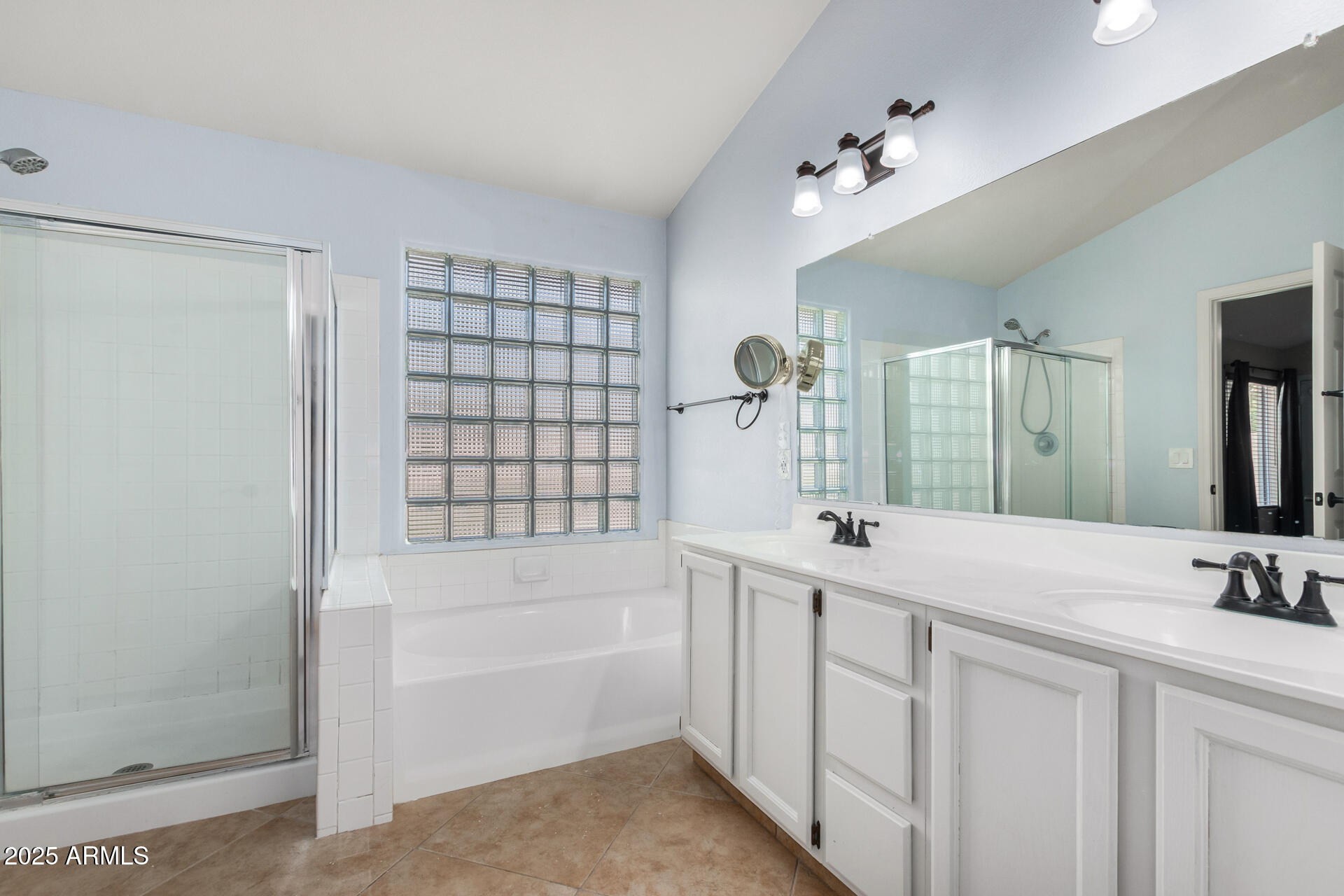 4226 East Rockledge Road Phoenix, AZ 85044 - Photo 19 of 36 a bathroom with a tub sink and mirror