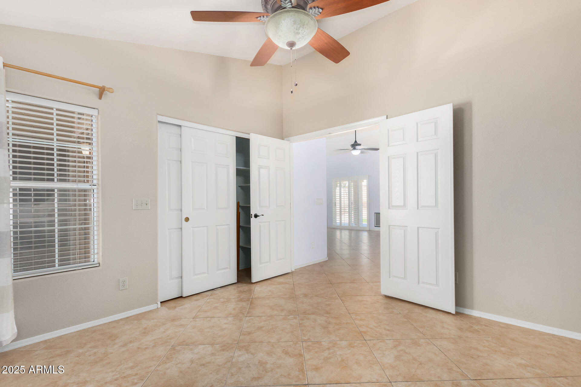 4226 East Rockledge Road Phoenix, AZ 85044 - Photo 25 of 36 a view of an empty room with a window