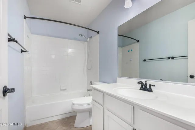 a bathroom with a sink a toilet and a tub