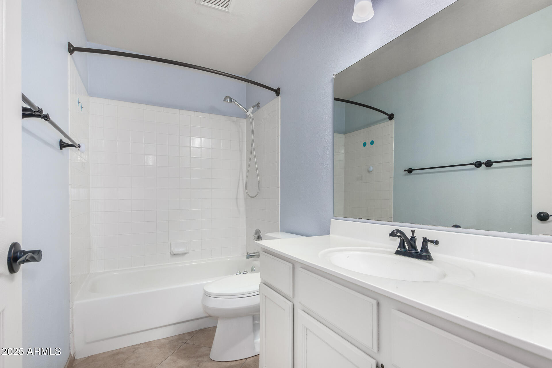 4226 East Rockledge Road Phoenix, AZ 85044 - Photo 26 of 36 a bathroom with a sink a toilet and a tub
